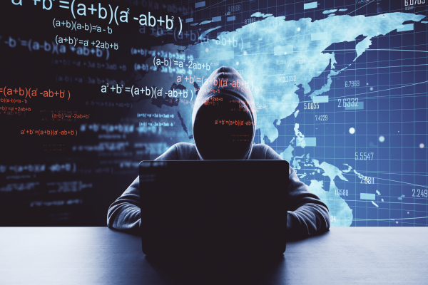 person-in-hood-using-laptop-with-digital-overlays-2026-03-26-04-46-40-utc 1